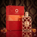 Frasco de Eau de Parfum Amber Rouge da Orientica, luxuoso e elegante, com detalhes dourados e tampa preta.